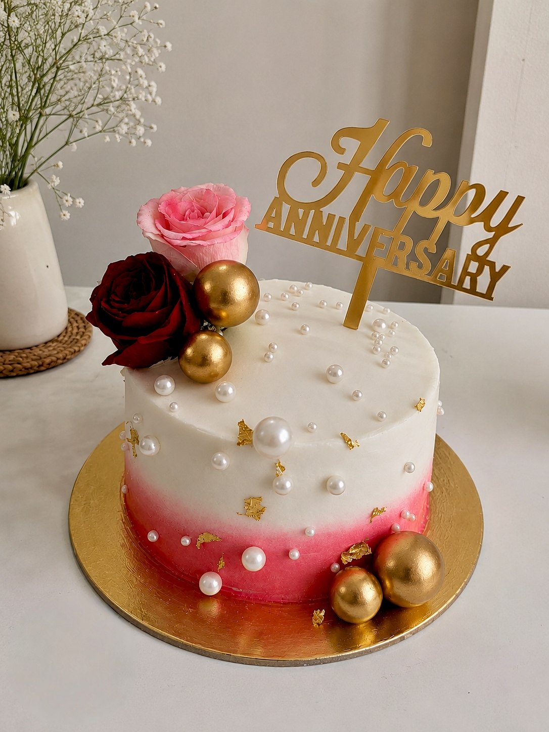 Pink ombre anniversary cake with pearls, gold spheres and fresh roses by Sweet Bloom Bakery, Asansol